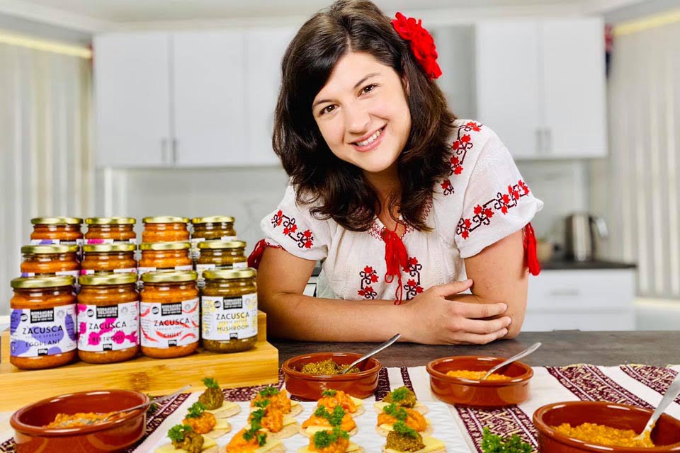 Alina Romanian Delights Owner with Zacusca Jars